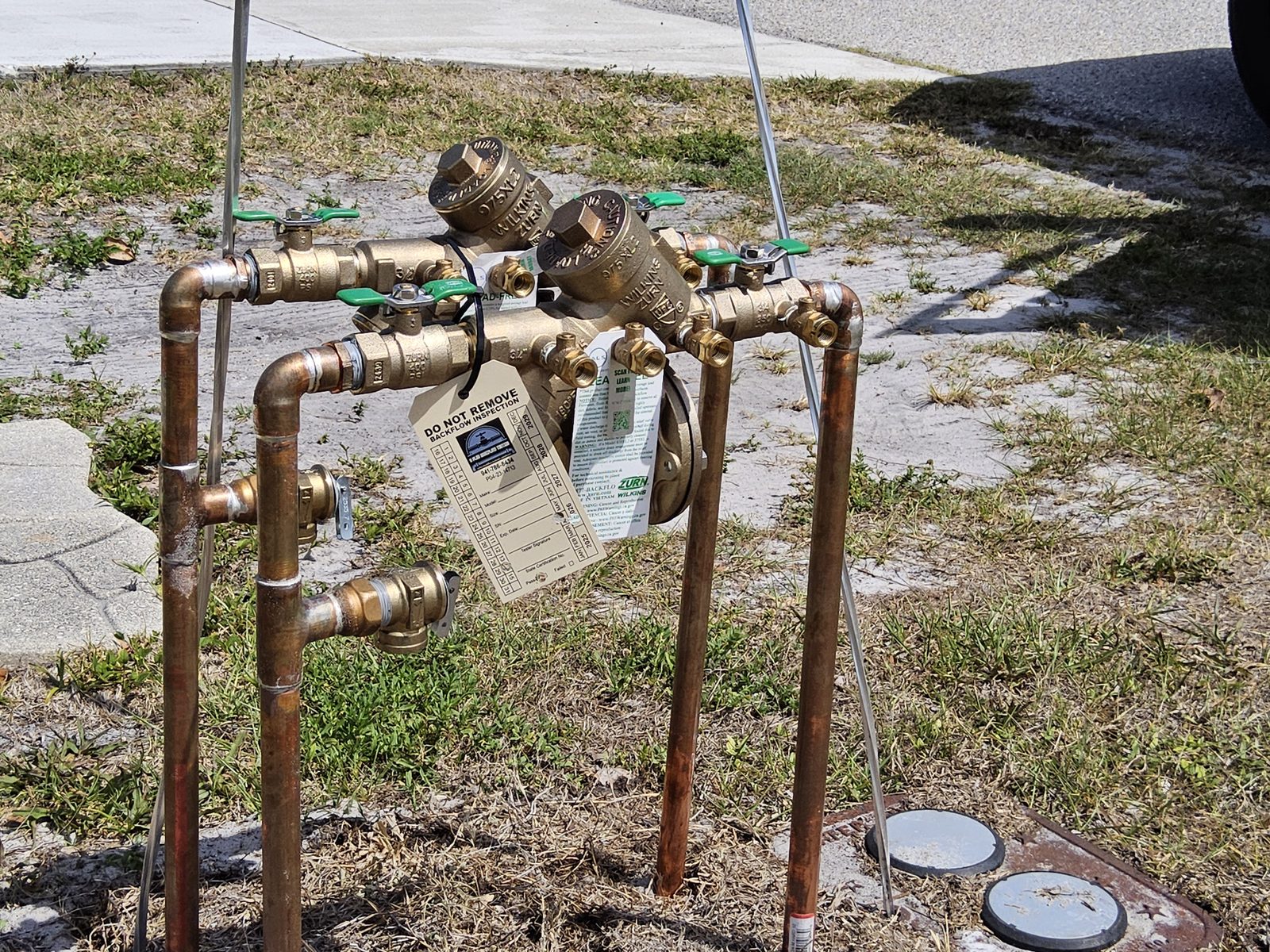Dual Wilkins Zurn 975XL2 RPZ backflow preventer replacement on a light-commercial water service in Charlotte County, FL.